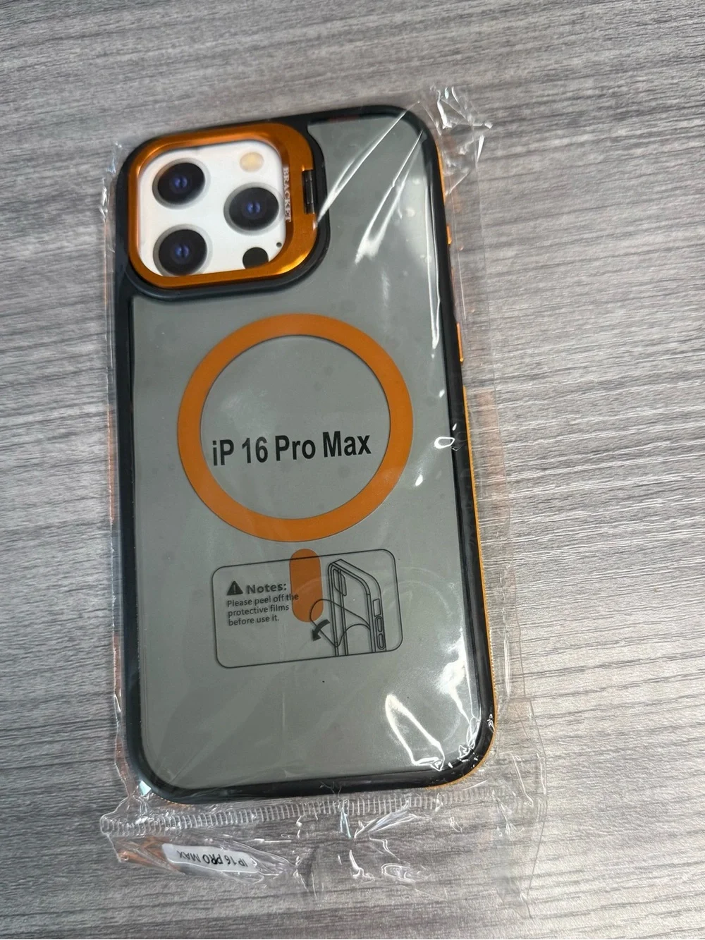 Transparent iPhone 16 Pro Max case, orange and black, MagSafe compatible.